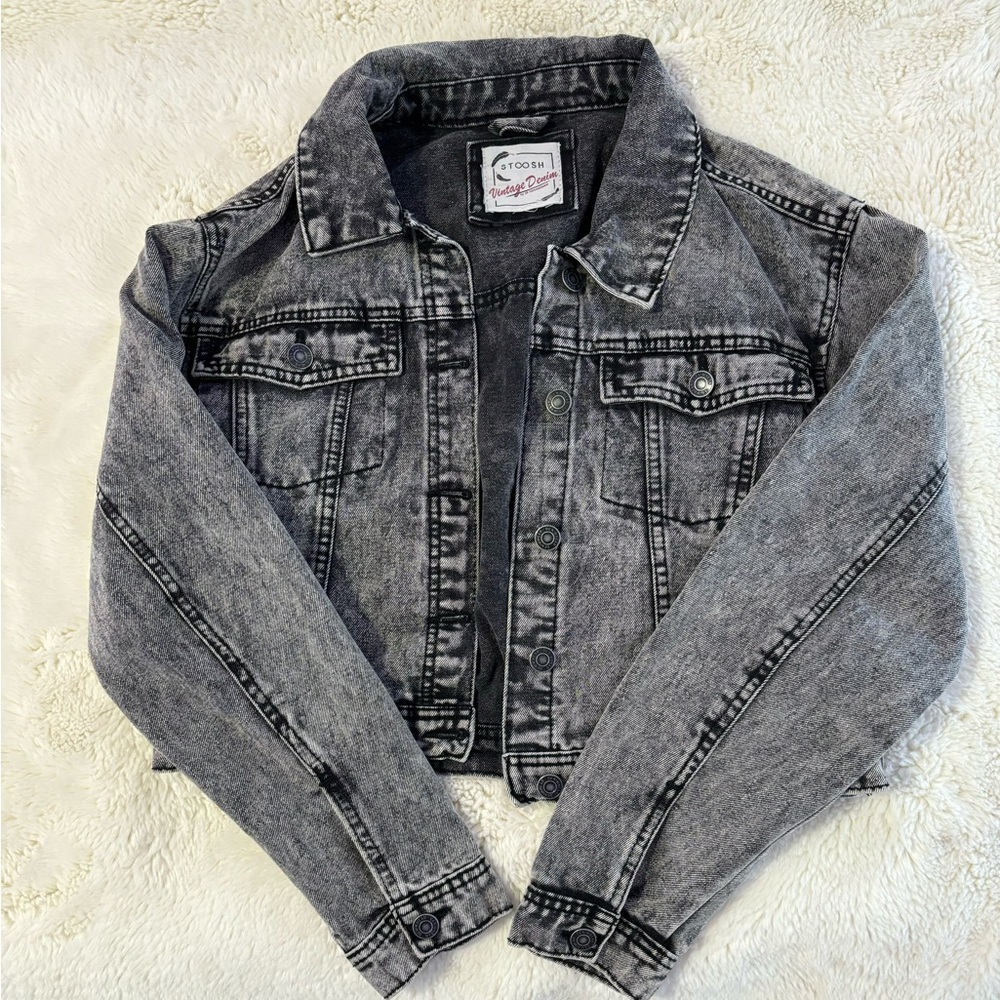cropped warn looking black jean jacket both fashionable and comfortable